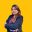 Professional woman in business attire posing confidently
